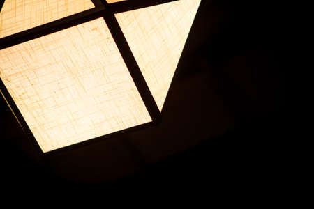 Electric lamps hanging on the ceiling in dinner time.の写真素材