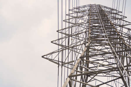 Under a power pole on the sky in sun light.の写真素材