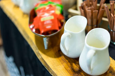 Two pitchers put on the coffee table in morning time.の写真素材