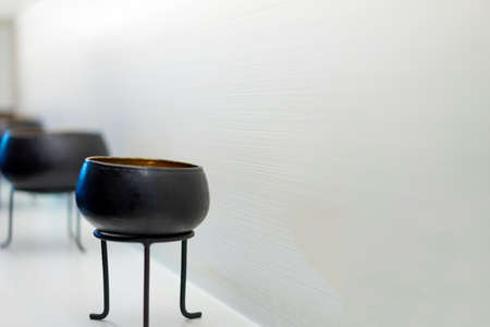 Cup of black paint to decorate the room on the table.の写真素材