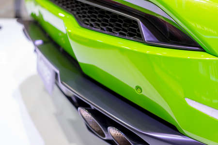 The car on display at the green light and sensitive in exhibition.