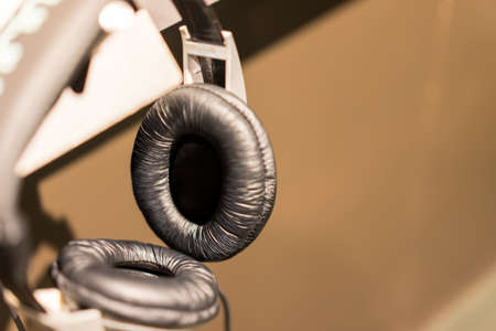 Headphones wrapped me in classical music in retro room.の写真素材