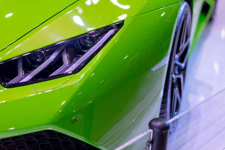 Green car in the exhibition room at the light sensitivity in Mega store.