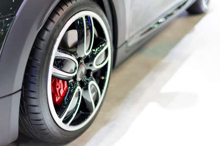 Black super car parked on the ground in exhibition.の写真素材