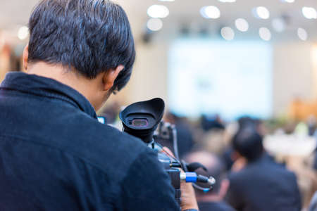 Photographers are making news in the meeting in meeting time.の写真素材