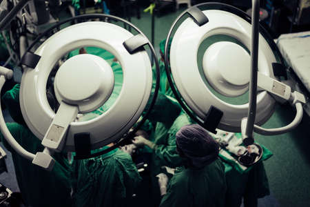 While surgery performed by emergency physicians and nurses in Operating Room.の写真素材