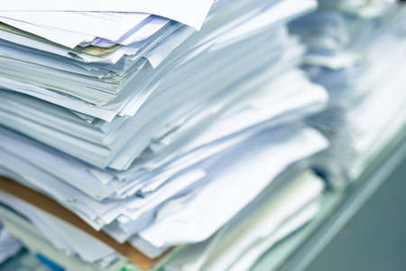Many stacks of paper placed in the office business.