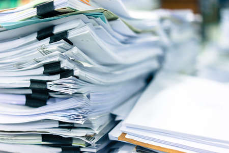 Many stacks of paper placed in the office at morning.の写真素材