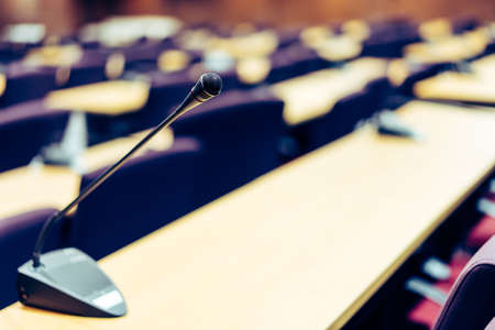 Microphones in empty conference room in vintage tone.の写真素材
