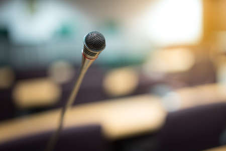 Microphones in empty conference room in sunshine.の写真素材