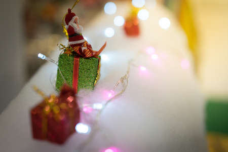 Santa Claus seats on a white background in the New Year party.の写真素材