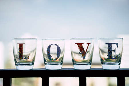 Glass wrote love laying on the side porch in old tone.の写真素材