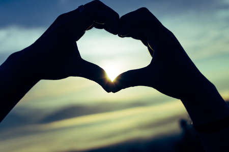Love the sky with two handat morning time.の写真素材
