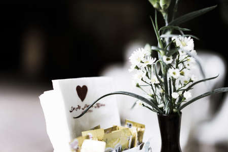 Flowers and a glass coffee table in the cafe at morning.の写真素材