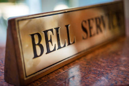 Signs bell on the table in a luxury hotel in morning.の写真素材