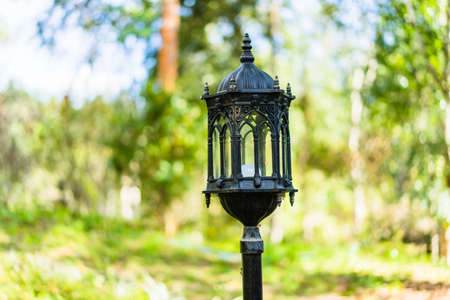 Black Lantern in the park in morning sun.の写真素材