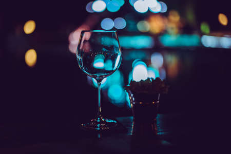 Empty wine glasses on the table at a party at night club.の写真素材