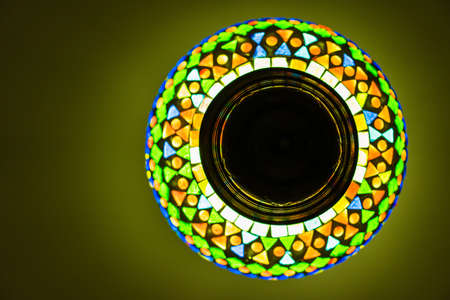 Light yellow color on a white background in dark.の写真素材