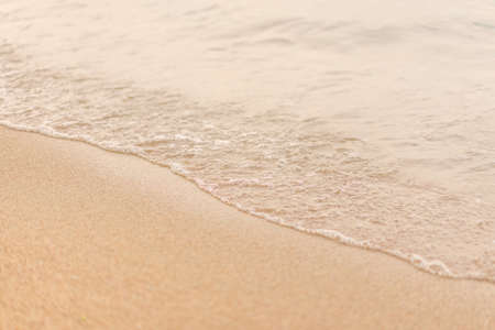 Clean beaches and sea waves in the evening sun. の写真素材