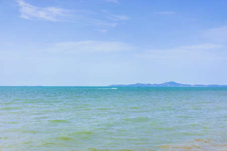 Cloudy sky and turquoise sea in the morning sun.の写真素材
