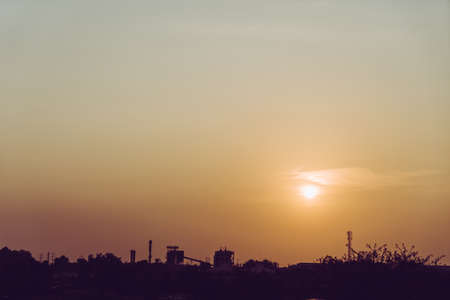 Sunset in the evening on the big city sky.の写真素材