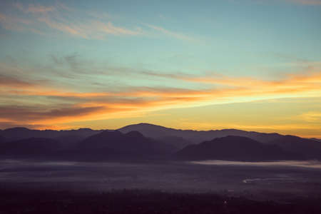 Misty morning sky above the city in old tone.の写真素材