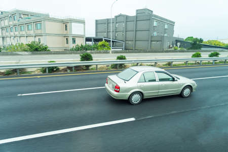 Cars are running in the morning day.の写真素材