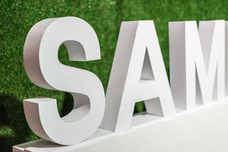 White text "SAM" on green background.の写真素材