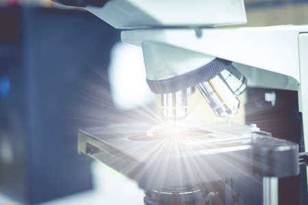 microscope in a science lab to find something special.の写真素材