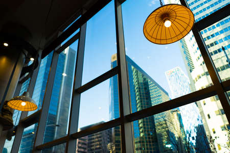 big city view from the bright morning in coffee shop.の写真素材