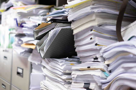 Many filing cabinets in a messy office without mess on bad work.の写真素材
