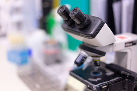 Old microscopes in science labs that are ready to use.