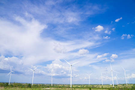 The wind turbines used to generate electricity provide clean energy to the earth on clear days.の写真素材