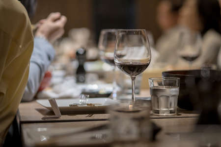 Wine glasses on the dining table in a fine restaurantの写真素材