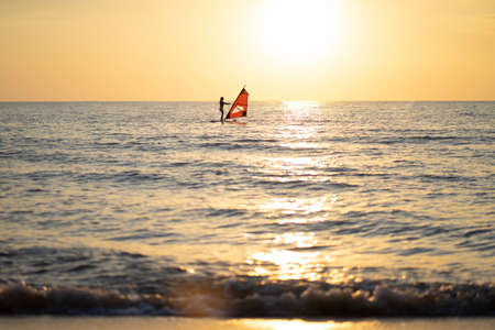 the sea, the beach in the evening when the sun goes down.の写真素材