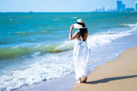girl in the sea on a beach on a clear day.の写真素材