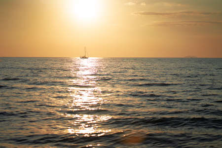 the sea, the beach in the evening when the sun goes down.の写真素材