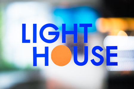 The text LIGHT HOME on the background uses a light effect.