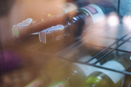 The wine bottles on the shelf use diffused light.の写真素材