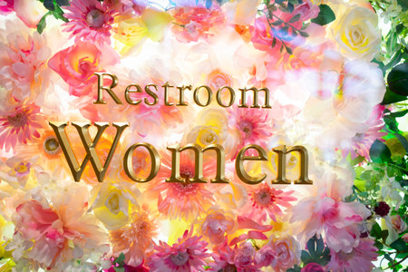 women toilet sign background decorated with colorful flowers.の写真素材
