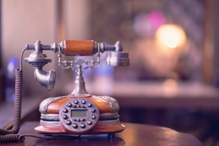 Brown classic antique telephone on the table.の写真素材