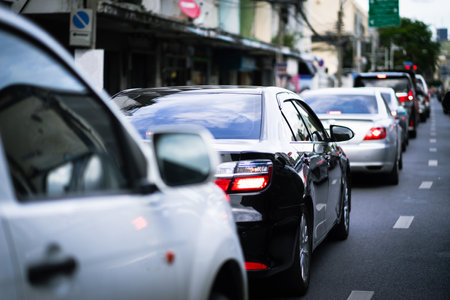 Rush hour cars on city streets. Cars on the highway in traffic jams.