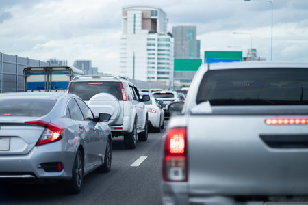 Rush hour cars on city streets. Cars on the highway in traffic jams.