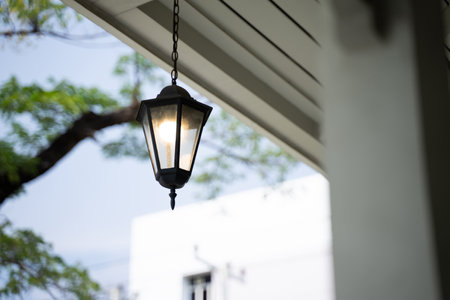 Shining lanterns hanging from the ceiling, blurred background.の写真素材
