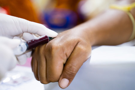 A nurse is taking a patient's blood for examination.の写真素材