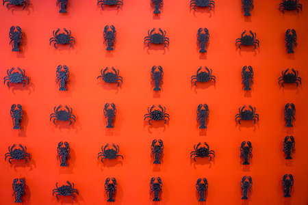 The red walls are decorated with crabs and crayfish on many of the walls inside the hotel.