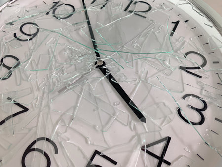 Clock with cracked glass and shattered art view.の写真素材