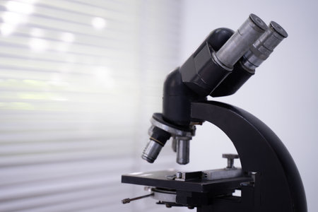 old retro scientific microscope bokeh light background.の写真素材