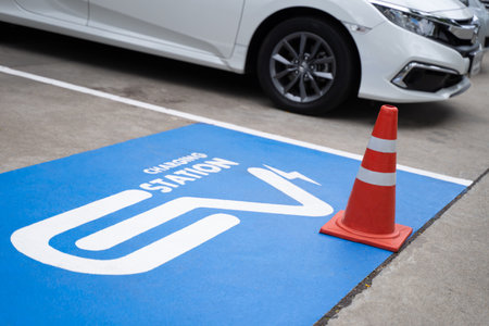 ev station solar electric vehicle charging station in public parking lot.の写真素材