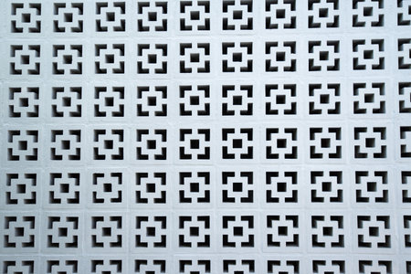 The white walls are decorated with square grooves to create a pattern.の写真素材